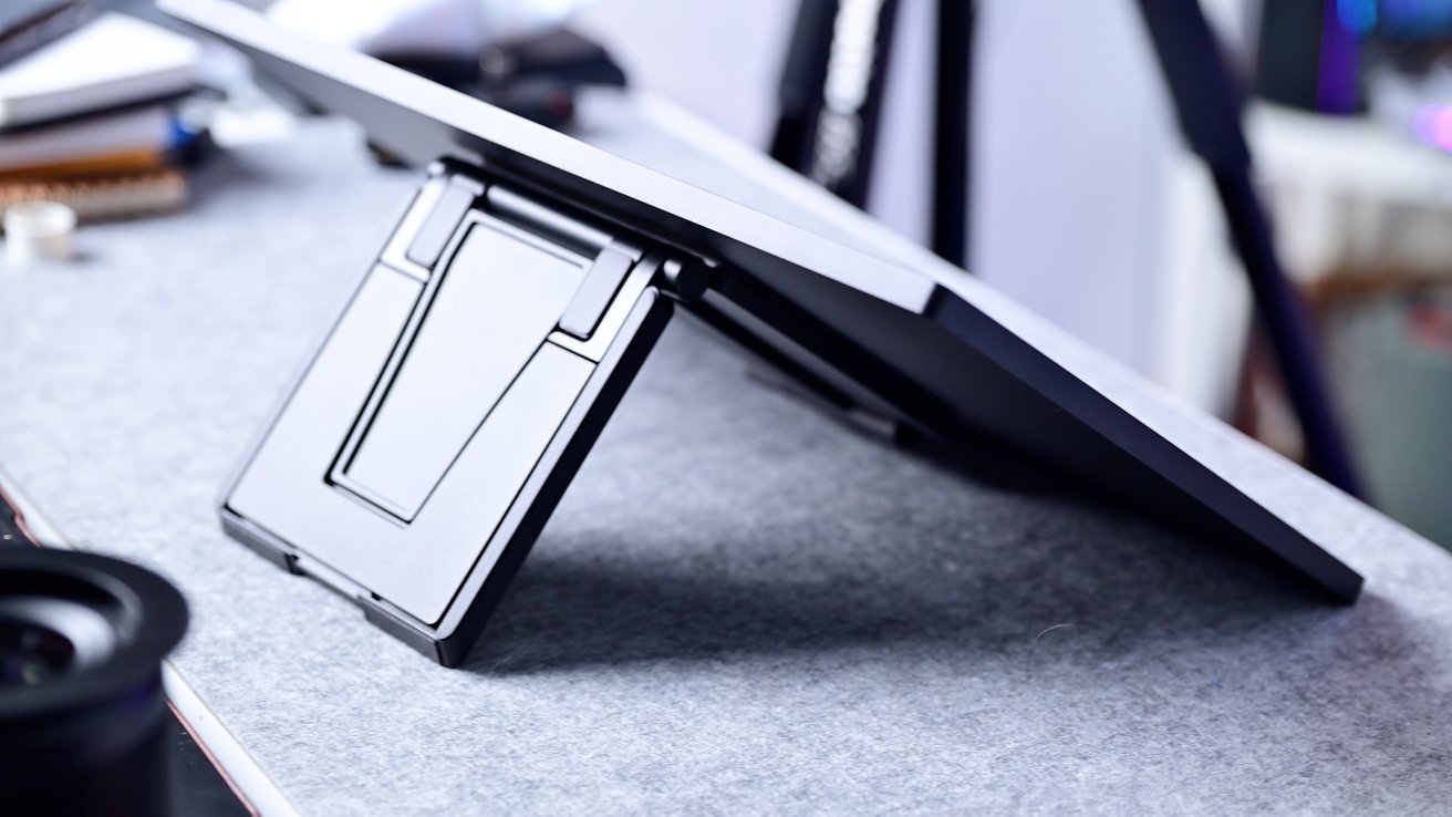 A metal stand holding up the back of a display at a low angle
