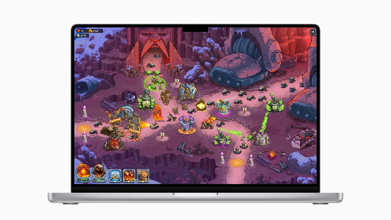 Fantasy-themed video game on a MacBook screen featuring colorful, animated characters and structures in a rocky, alien landscape with vibrant visual effects and strategic gameplay elements.