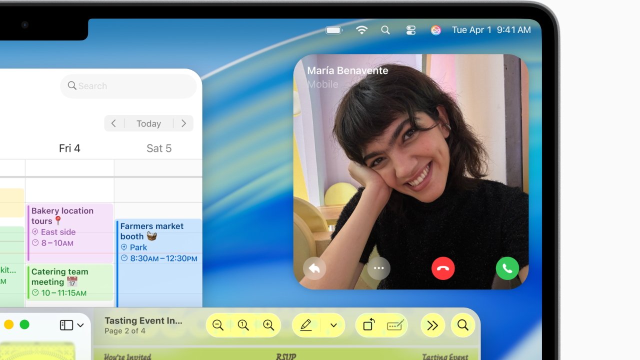 A smiling person in a dark shirt is video calling on a digital device displaying a calendar with scheduled events.